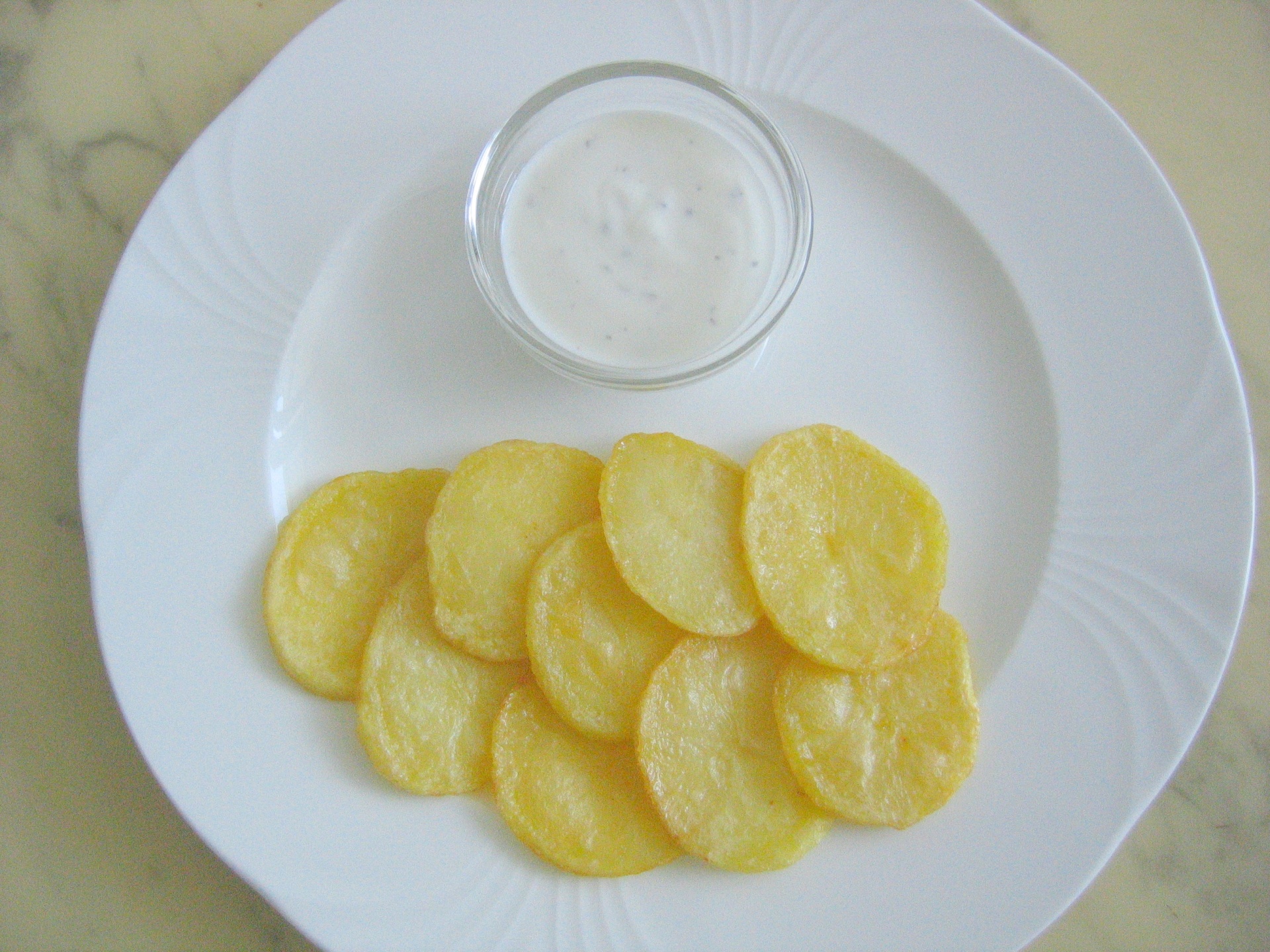 Kartoffelscheiben auf griechische Art mit
              Tsatski
